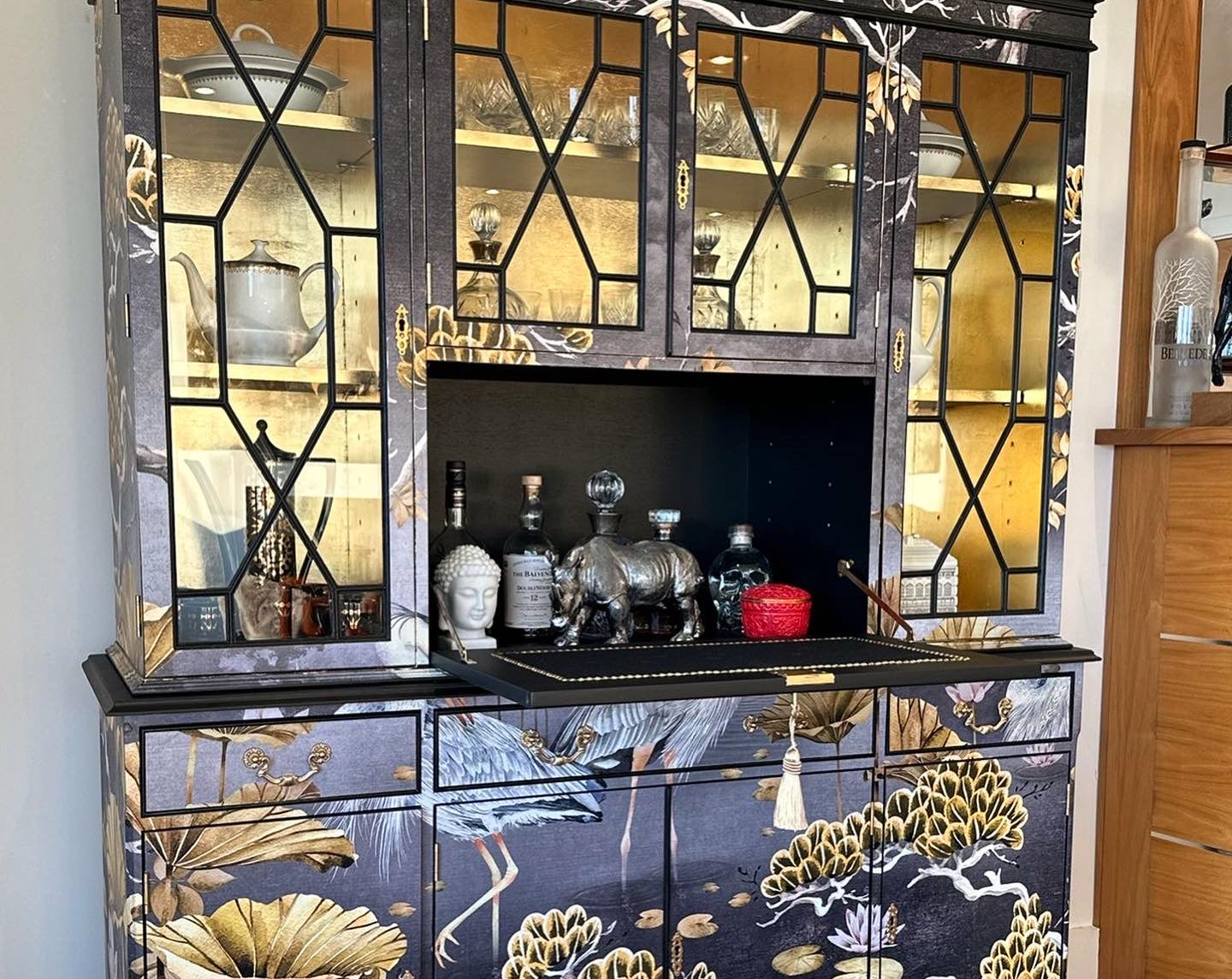 Upcycled cocktail cabinet display unit in gold and black