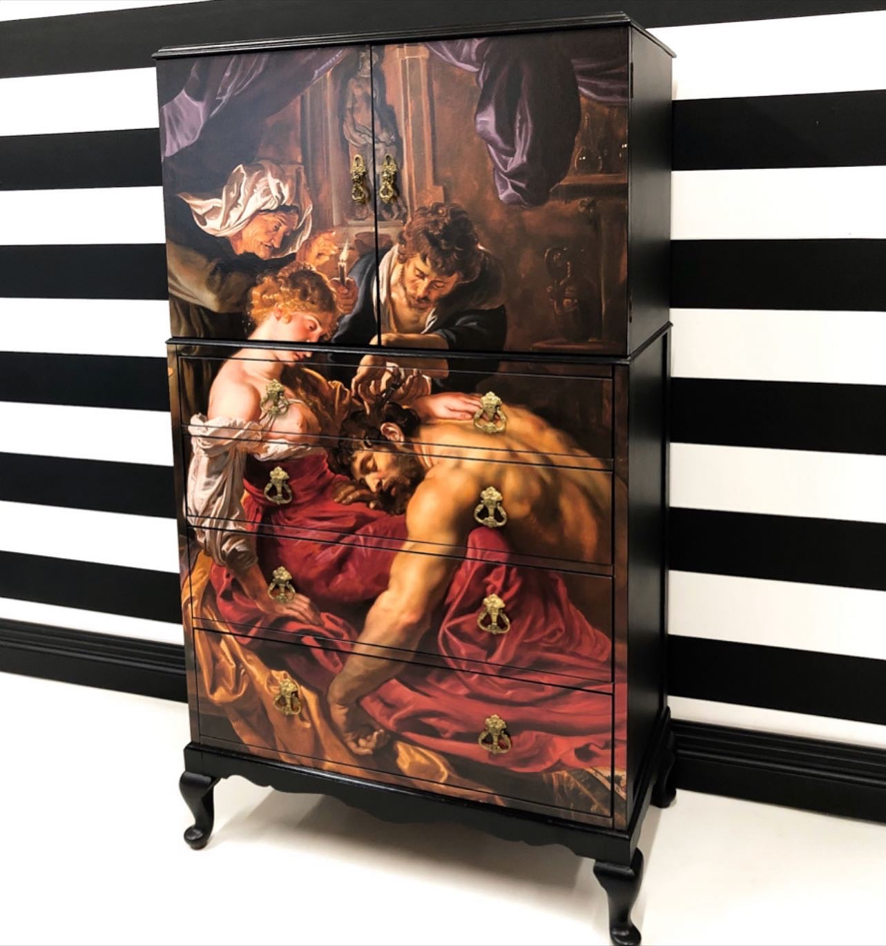 Upcycled cocktail cabinet with a classic art design on the front